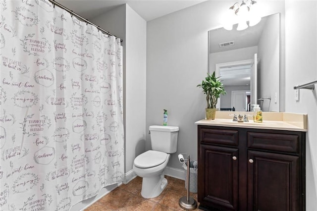 bathroom with toilet, a shower with shower curtain, and vanity