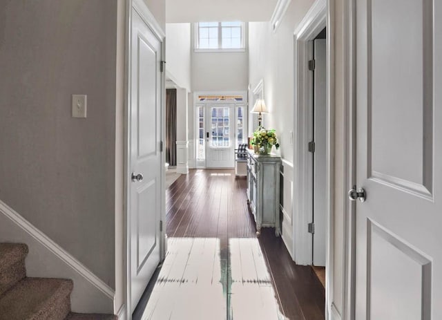 corridor featuring dark hardwood / wood-style floors and french doors