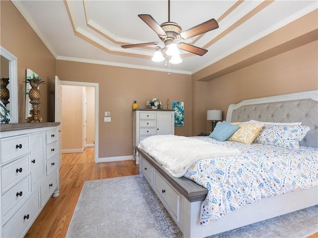 bedroom with light hardwood / wood-style flooring, crown molding, and ceiling fan