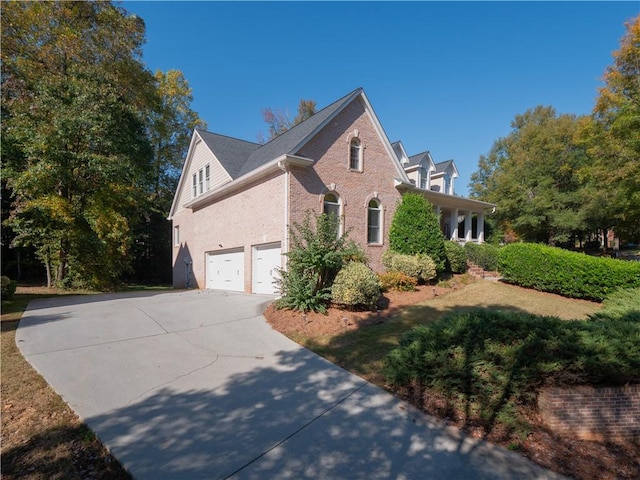 view of side of property with a garage