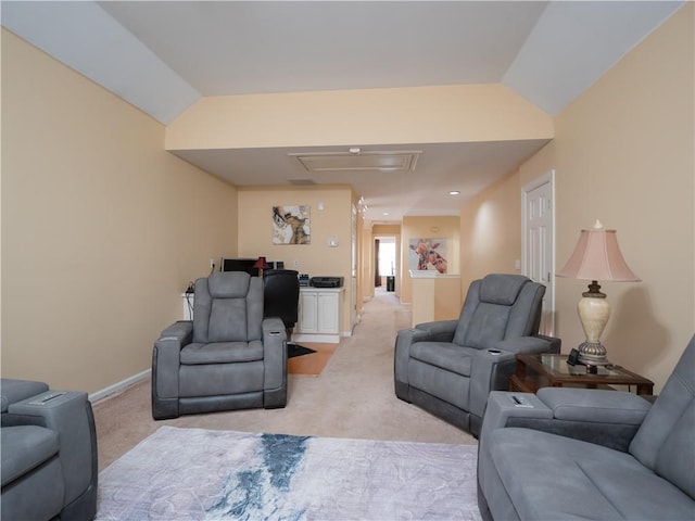 carpeted living room featuring vaulted ceiling