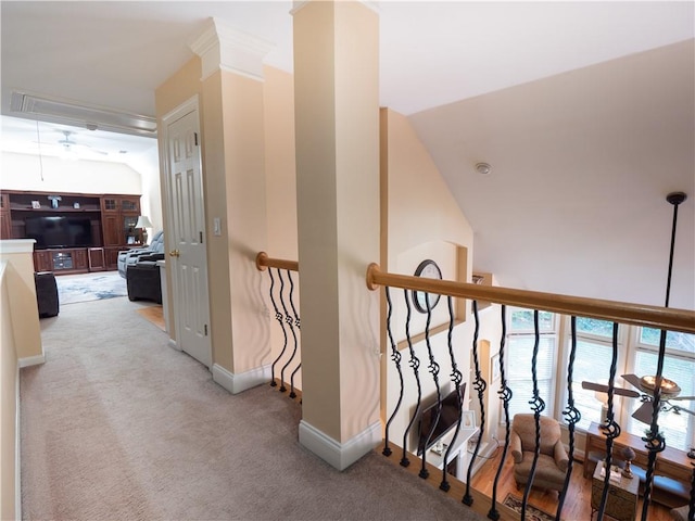 hall featuring light carpet and lofted ceiling