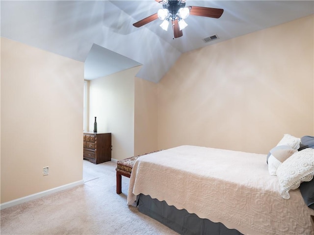 carpeted bedroom with lofted ceiling and ceiling fan