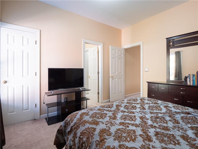 bedroom with light colored carpet