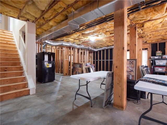 basement with black refrigerator