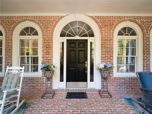 doorway to property with covered porch