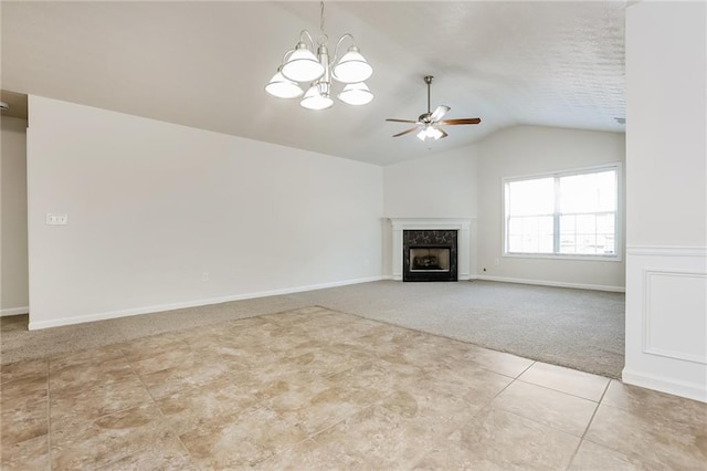 unfurnished living room featuring carpet floors, a high end fireplace, vaulted ceiling, tile patterned flooring, and baseboards