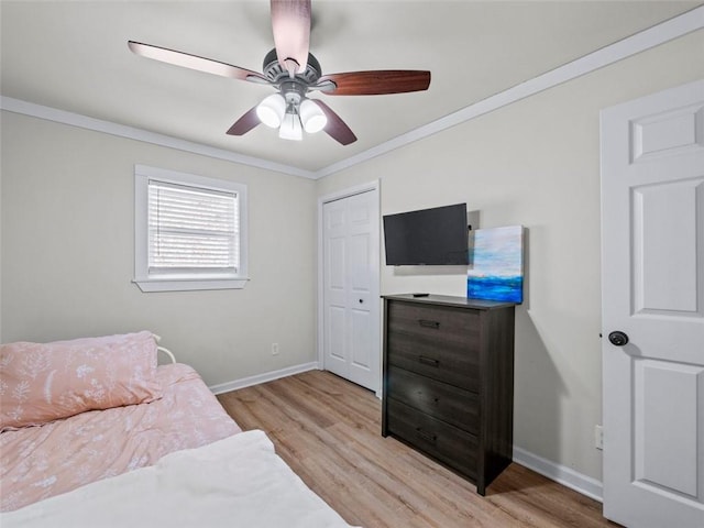 bedroom featuring crown molding, ceiling fan, and light hardwood / wood-style flooring