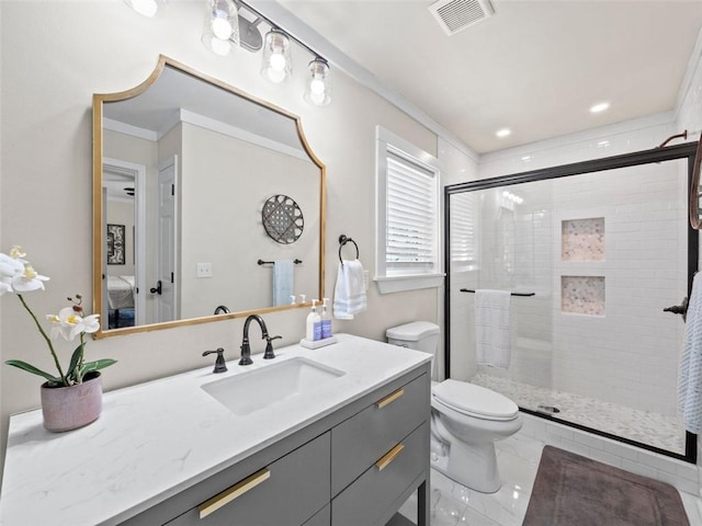 bathroom with vanity, an enclosed shower, crown molding, and toilet