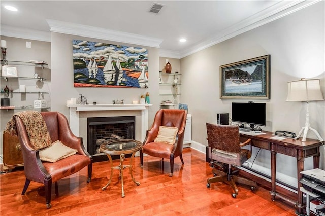 office space with hardwood / wood-style flooring and ornamental molding