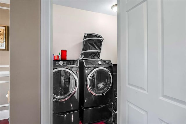 laundry room featuring washer and clothes dryer