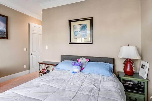 carpeted bedroom with ornamental molding