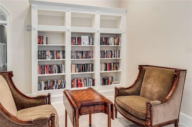 living area with built in features and carpet flooring