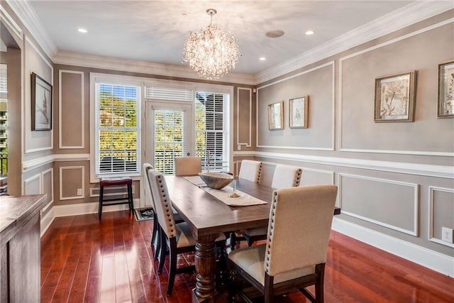 dining room with crown molding, a notable chandelier, and dark hardwood / wood-style flooring