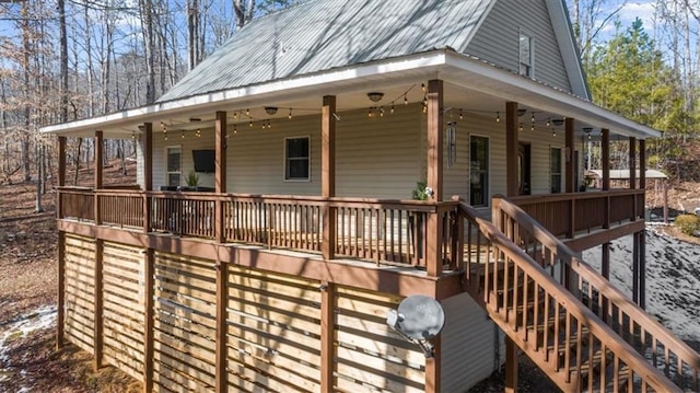 deck with a porch and stairs