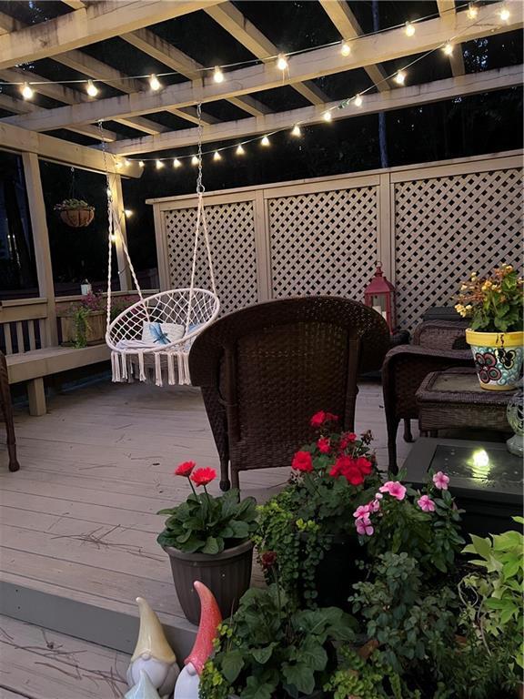 deck at twilight with a pergola