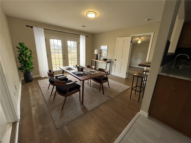 1929 Hazelwood Dr SE, Marietta, GA 30067 - dining room with french doors, dark wood-style flooring, and ceiling fan
