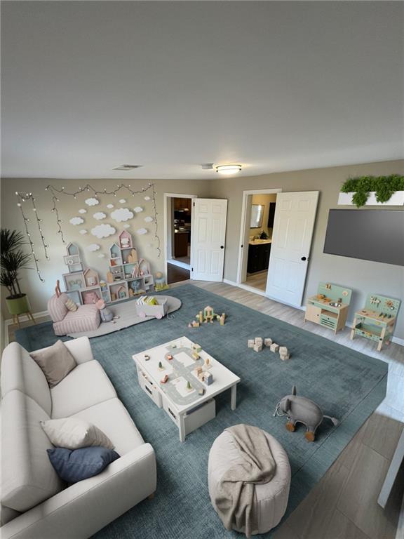 1929 Hazelwood Dr SE, Marietta, GA 30067 - living area featuring wood finished floors and baseboards