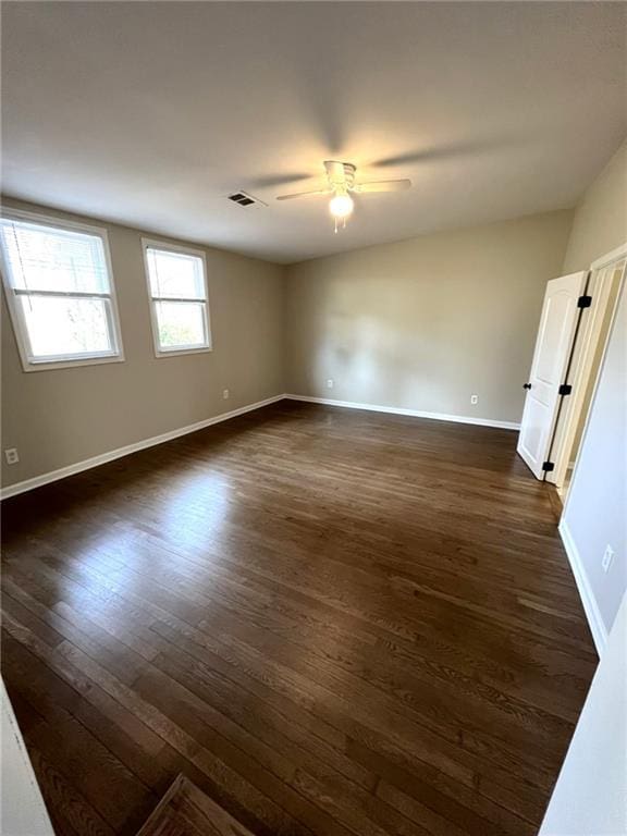 1929 Hazelwood Dr SE, Marietta, GA 30067 - spare room featuring dark wood-type flooring and a ceiling fan
