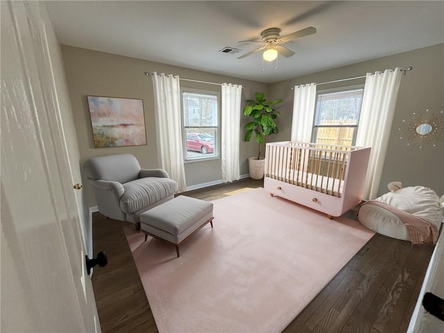 1929 Hazelwood Dr SE, Marietta, GA 30067 - bedroom featuring wood finished floors, multiple windows, and ceiling fan