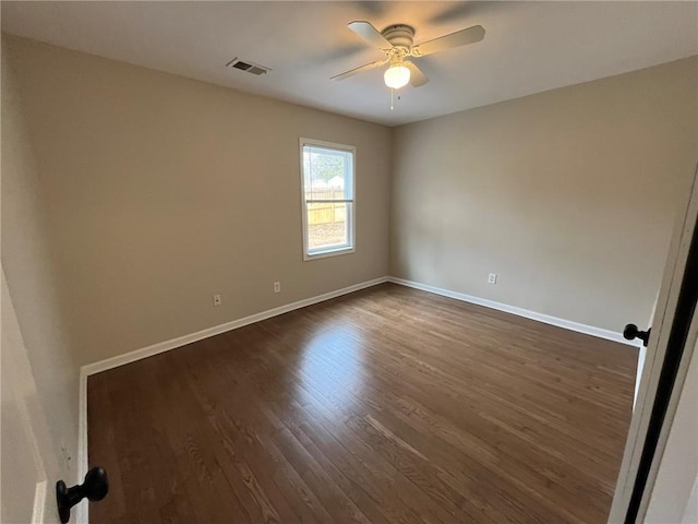 1929 Hazelwood Dr SE, Marietta, GA 30067 - spare room featuring ceiling fan and dark wood-style flooring