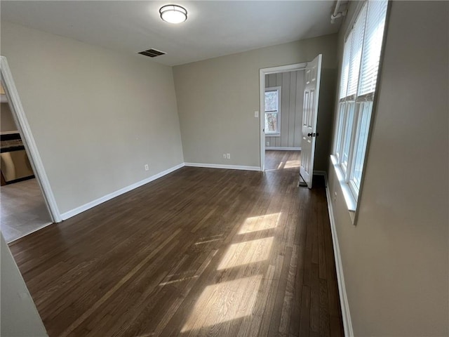1929 Hazelwood Dr SE, Marietta, GA 30067 - empty room featuring healthy amount of natural light and dark wood-style flooring