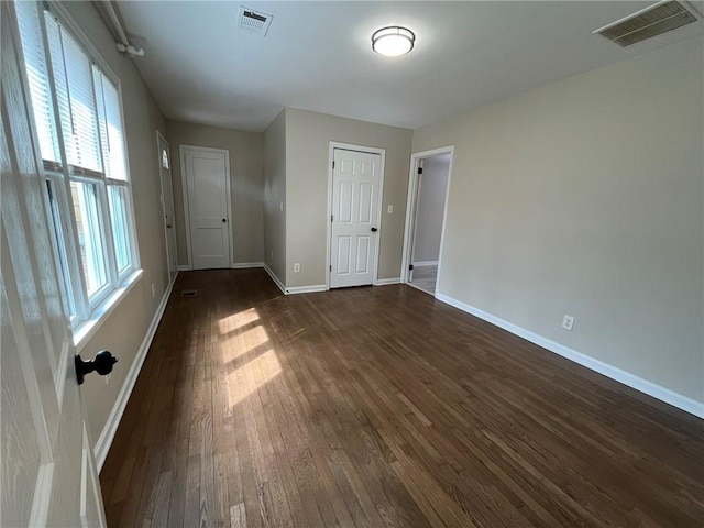 1929 Hazelwood Dr SE, Marietta, GA 30067 - spare room with dark wood-style floors and plenty of natural light