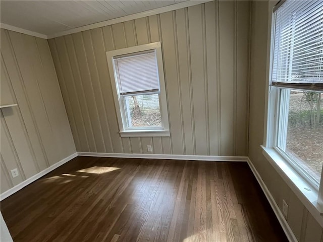 1929 Hazelwood Dr SE, Marietta, GA 30067 - empty room featuring dark wood-style floors, healthy amount of natural light, and crown molding