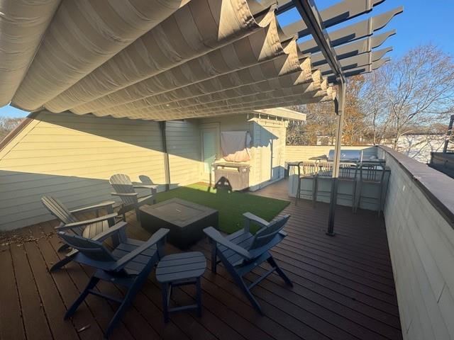 wooden terrace featuring a pergola