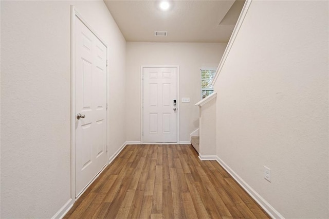 hall featuring wood-type flooring