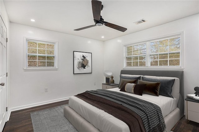 bedroom with recessed lighting, multiple windows, wood finished floors, and visible vents