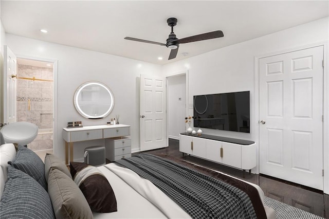 bedroom featuring recessed lighting, dark wood-type flooring, connected bathroom, and ceiling fan