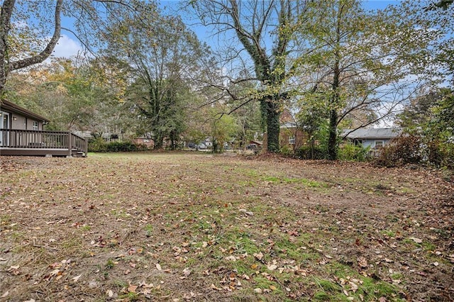 view of yard with a wooden deck