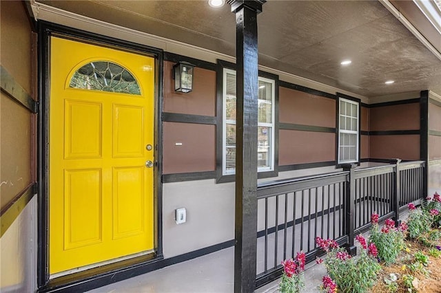 view of exterior entry featuring a porch