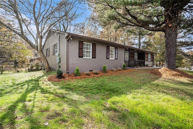 ranch-style house with brick siding, a front yard, and fence