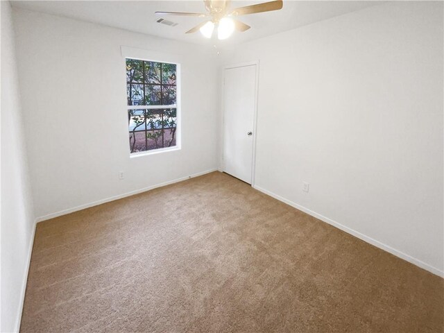 4727 Garden Hills Dr, Stone Mountain, GA 30083 - carpeted spare room with ceiling fan and baseboards