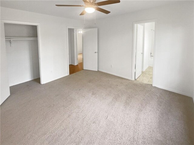4727 Garden Hills Dr, Stone Mountain, GA 30083 - unfurnished bedroom with carpet, a closet, ceiling fan, and connected bathroom