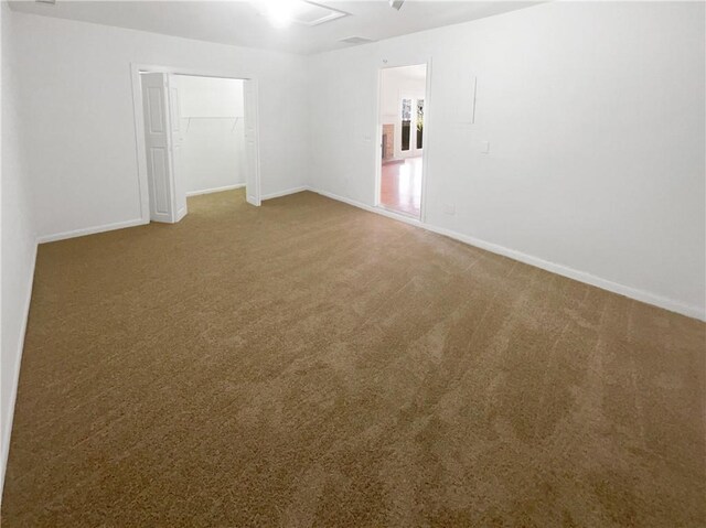 4727 Garden Hills Dr, Stone Mountain, GA 30083 - carpeted spare room featuring baseboards