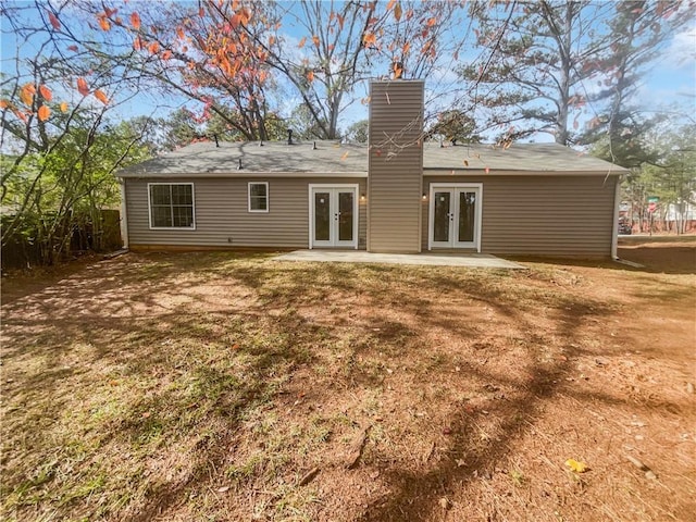 4727 Garden Hills Dr, Stone Mountain, GA 30083 - rear view of house featuring french doors, a chimney, and a patio area