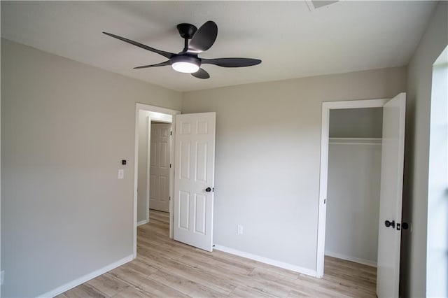 5072 Plantation View Trl, Stone Mountain, GA 30088 - unfurnished bedroom featuring a closet, light wood-style flooring, and baseboards