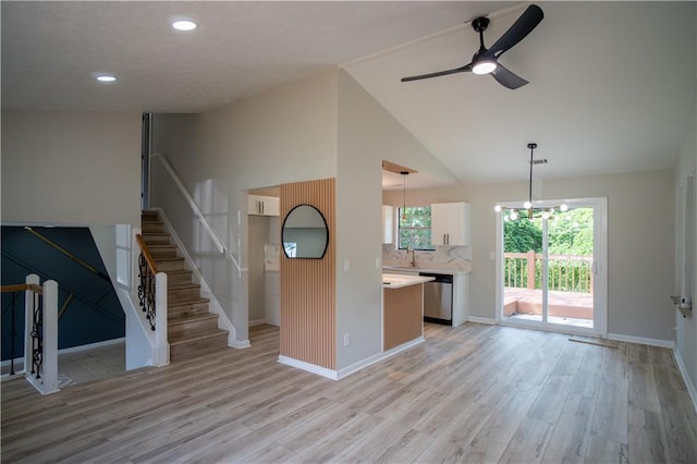 5072 Plantation View Trl, Stone Mountain, GA 30088 - unfurnished living room with light wood-style flooring, ceiling fan, baseboards, recessed lighting, and vaulted ceiling