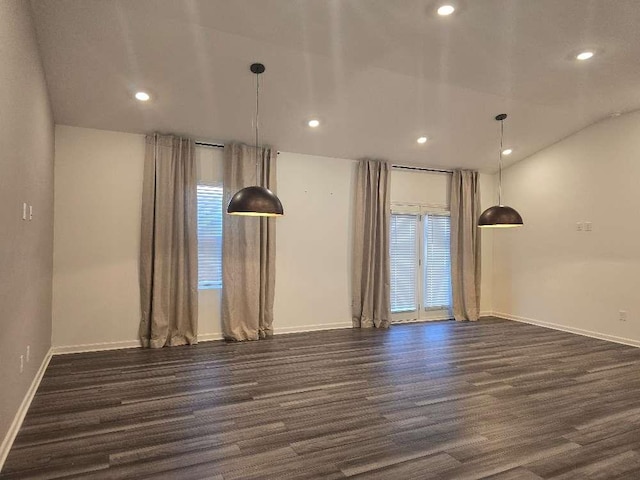 empty room with dark hardwood / wood-style flooring