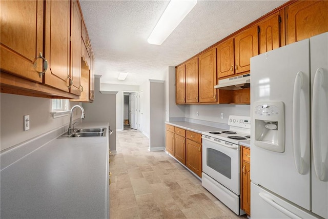 350 Dailey Mill Rd, Mcdonough, GA 30253 - kitchen with white appliances, under cabinet range hood, a textured ceiling, brown cabinets, and light countertops