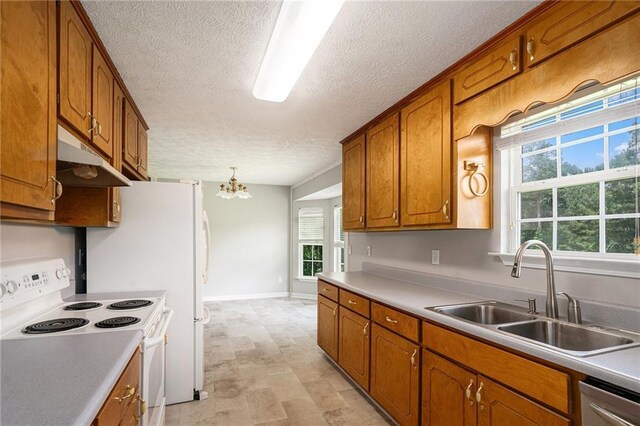 350 Dailey Mill Rd, Mcdonough, GA 30253 - kitchen with white electric range oven, brown cabinetry, a chandelier, under cabinet range hood, and a textured ceiling