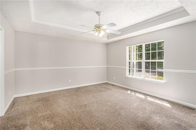 350 Dailey Mill Rd, Mcdonough, GA 30253 - empty room featuring a textured ceiling, a tray ceiling, ceiling fan, carpet floors, and crown molding