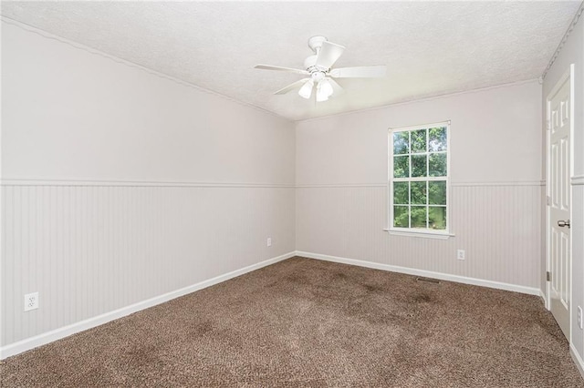 350 Dailey Mill Rd, Mcdonough, GA 30253 - unfurnished room with a textured ceiling, carpet, a ceiling fan, and a wainscoted wall