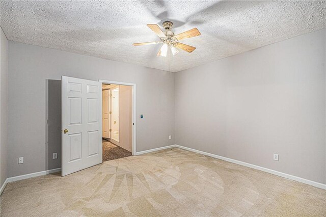 350 Dailey Mill Rd, Mcdonough, GA 30253 - spare room featuring ceiling fan, light colored carpet, and a textured ceiling