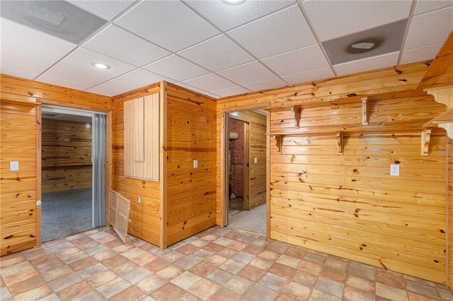 350 Dailey Mill Rd, Mcdonough, GA 30253 - spare room featuring wood walls, stone finish floors, a paneled ceiling, and recessed lighting