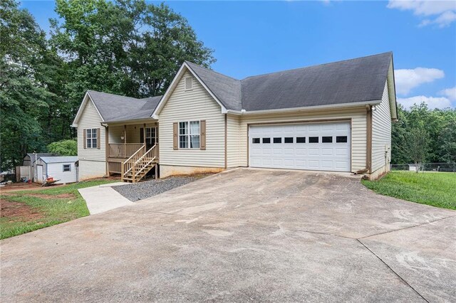 350 Dailey Mill Rd, Mcdonough, GA 30253 - single story home with driveway, a storage unit, a garage, and a shingled roof