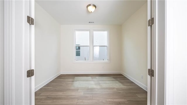 empty room with light hardwood / wood-style floors